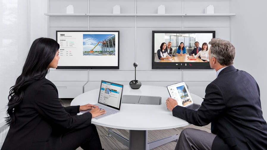 People around video conference table